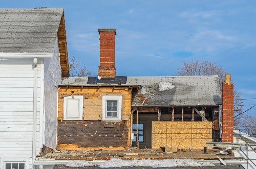 A home has an addition built onto the back.